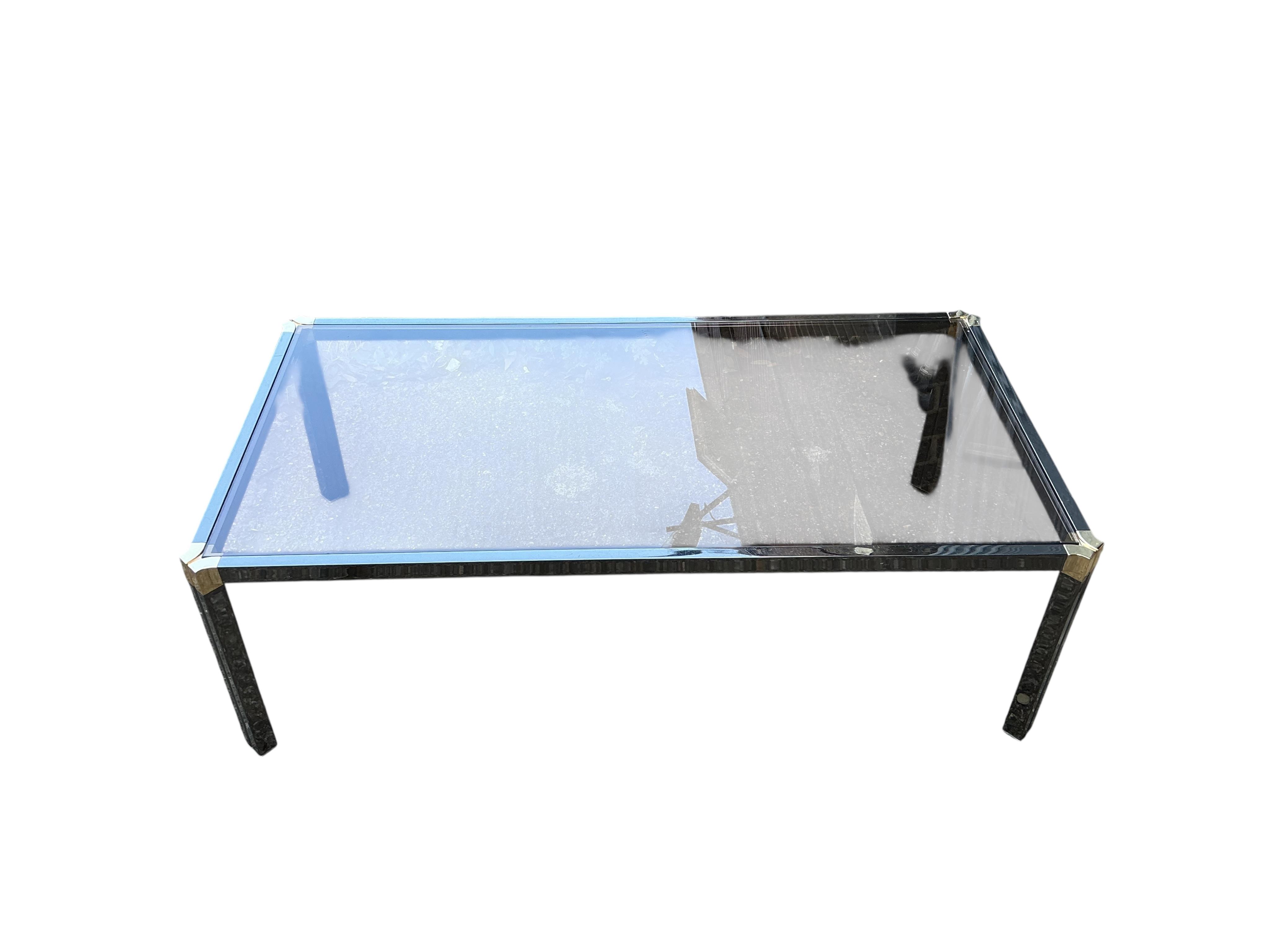 A Pierre Vandel rectangular glass top coffee table. Width 115cm, depth 60cm, height 37cm.